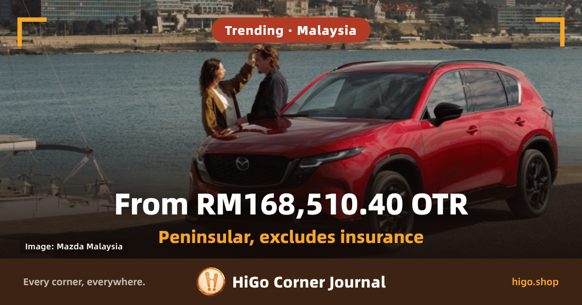 Cover card: three-quarter front view of a red Mazda CX-5 parked on tarmac by the water, facing left; a white sailboat is moored at the left and a hillside town sits across the bay; a woman and a man stand beside the bonnet, she is reaching up to his hair. Text: a rounded chip at the top reads 'Trending · Malaysia', a small chip at the bottom left reads 'Image: Mazda Malaysia', the large heading reads 'From RM168,510.40 OTR', an orange line below it reads 'Peninsular, excludes insurance', and a dark strip at the foot reads 'Every corner, everywhere.', 'HiGo Corner Journal', 'higo.shop'.